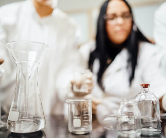 Woman Looking at Slide Through Microscope